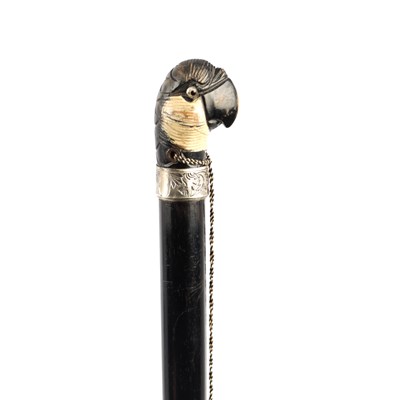 Lot 638 - A 19TH CENTURY CARVED AND PAINTED PARROT HEAD HANDLED WALKING STICK