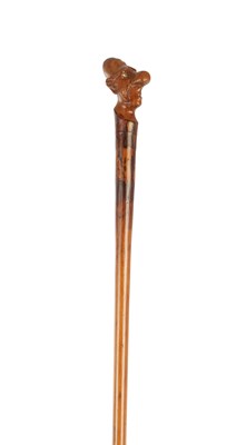Lot 1082 - A 19TH CENTURY CARVED HARDWOOD GROTESQUE WALKING STICK
