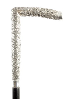 Lot 613 - A 19TH CENTURY ORIENTAL SILVER MOUNTED WALKING STICK