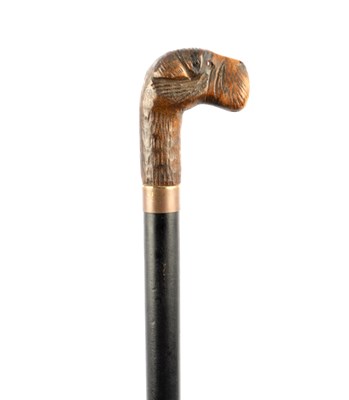 Lot 619 - A LATE 19TH CENTURY CARVED WOOD TERRIER'S HEAD HANDLED WALKING STICK