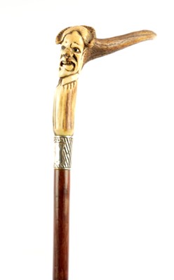 Lot 1072 - A 19TH CENTURY CARVED HORN GROTESQUE WALKING STICK