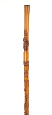Lot 1062 - A LATE 19TH CENTURY MEXICAN FOLK ART WALKING CANE