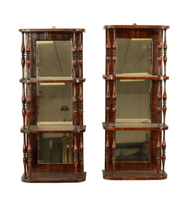 Lot 1181 - A PAIR OF LATE REGENCY FIGURED ROSEWOOD HANGING SHELVES