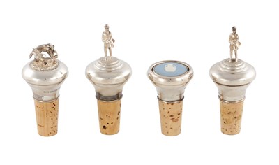 Lot 381 - A COLLECTION OF FOUR STERLING SILVER-TOPPED CORK BOTTLE STOPPERS