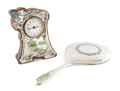 Lot 324 - AN ART NOUVEAU SILVER AND ENAMEL CLOCK AND HAND MIRROR