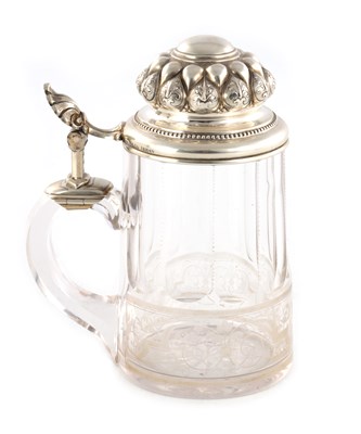Lot 428 - A 19TH CENTURY GERMAN SILVER AND CUT GLASS TANKARD