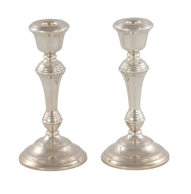 Lot 393 - A PAIR OF MID 20TH CENTURY SILVER CANDLESTICKS