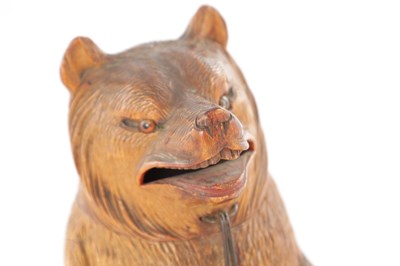 Lot 1083 - AN UNUSUAL LATE 19TH CENTURY CARVED WOOD BLACK FOREST SEATED BEAR MONEY BOX