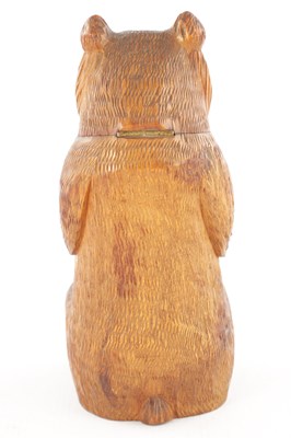 Lot 1083 - AN UNUSUAL LATE 19TH CENTURY CARVED WOOD BLACK FOREST SEATED BEAR MONEY BOX