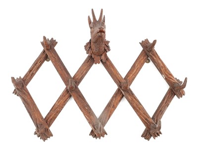 Lot 944 - A LATE 19TH CENTURY CARVED OAK BLACK FOREST FOLDING TELESCOPIC HANGING COAT/HAT RACK