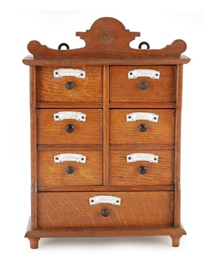 Lot 957 - A LATE 19TH CENTURY SMALL OAK HANGING SPICE CABINET