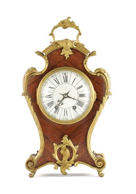Lot 1370 - A LATE 19TH CENTURY WALNUT AND ORMOLU MOUNTED MATEL CLOCK