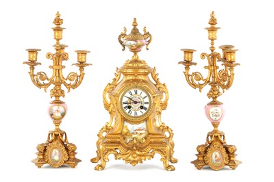 Lot 1577 - A LATE 19TH CENTURY FRENCH GILT PORCELAIN PANELLED CLOCK GARNITURE