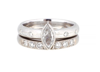 Lot 550 - A PLATINUM DIAMOND BRIDAL SET ENGAGEMENT RING AND MATCHING WEDDING BAND