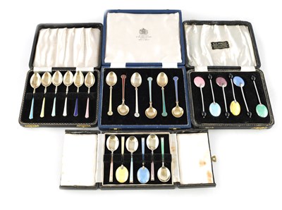 Lot 348 - FOUR CASED SETS OF SILVER AND ENAMEL TEA AND COFFEE SPOONS