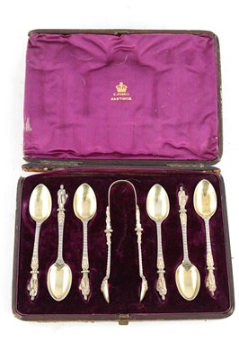 Lot 480 - A SET OF VICTORIAN SILVER GILT APOSTLE TEASPOONS AND TONGS