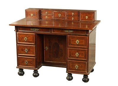Lot 1245 - A 17TH CENTURY FIGURED WALNUT KNEEHOLE DESK