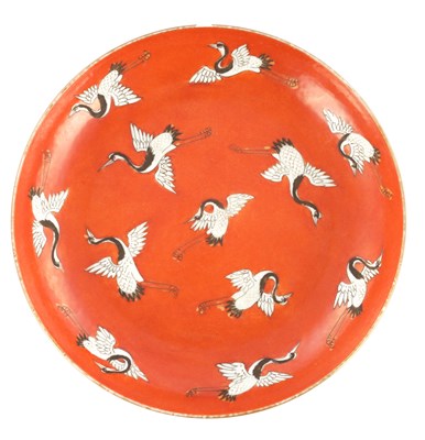 Lot 158 - A CHINESE IRON-RED GROUND 'CRANE' PLATE