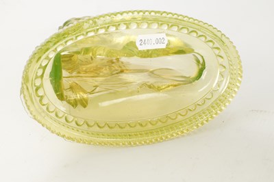 Lot 14 - A PAIR OF HENRY GREENER YELLOW PRESSED GLASS SCULPTURES OF SEATED LIONS