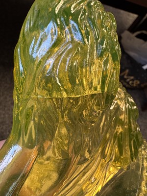 Lot 14 - A PAIR OF HENRY GREENER YELLOW PRESSED GLASS SCULPTURES OF SEATED LIONS