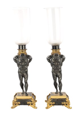 Lot 843 - A PAIR OF REGENCY BRONZE AND GILT ORMOLU FIGURAL CANDLE LAMPS