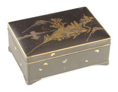 Lot 233 - A JAPANESE MEIJI PERIOD IRON CIGARETTE BOX WITH INLAID DESIGN OF HUTS AND MOUNT FUJI