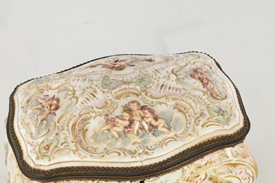 Lot 78 - A LATE 19TH CENTURY ITALIAN CAPODIMONTE GILT METAL MOUNTED PORCELAIN TABLE JEWELLERY CASKET