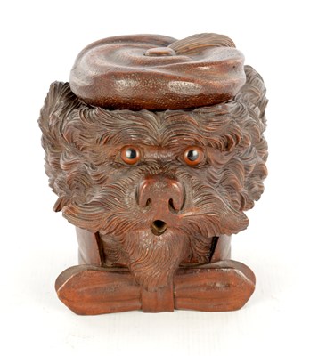 Lot 1156 - A 19TH CENTURY CARVED LINDENWOOD BLACK FOREST TOBACCO JAR