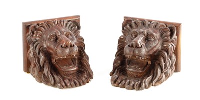 Lot 1146 - A PAIR OF 18TH CENTURY CARVED WALNUT LIONS MASK WALL BRACKETS