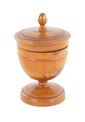 Lot 1097 - A 19TH CENTURY TREEN TURNED FRUITWOOD LIDDED URN