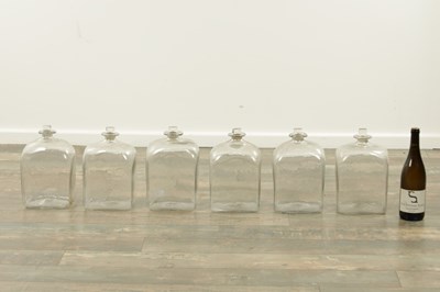 Lot 22 - A SET OF SIX GEORGIAN CLEAR GLASS BOTTLES