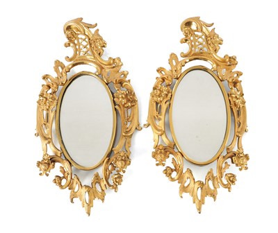Lot 756 - A PAIR OF 19TH CENTURY FRENCH MERCURY GILDED ORMOLU OVAL HANGING MIRRORS
