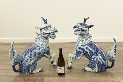Lot 43 - A PAIR OF DELFT BLUE AND WHITE PORCELAIN MYTHICAL QILINS
