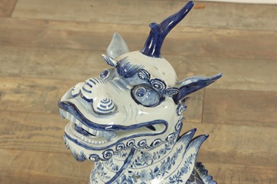 Lot 43 - A PAIR OF DELFT BLUE AND WHITE PORCELAIN MYTHICAL QILINS