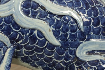 Lot 43 - A PAIR OF DELFT BLUE AND WHITE PORCELAIN MYTHICAL QILINS
