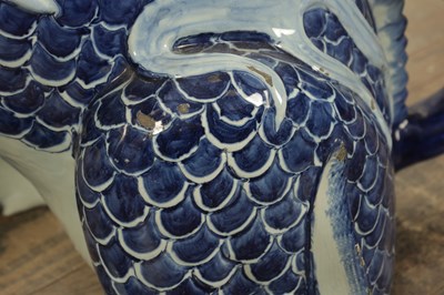 Lot 43 - A PAIR OF DELFT BLUE AND WHITE PORCELAIN MYTHICAL QILINS