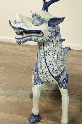 Lot 43 - A PAIR OF DELFT BLUE AND WHITE PORCELAIN MYTHICAL QILINS