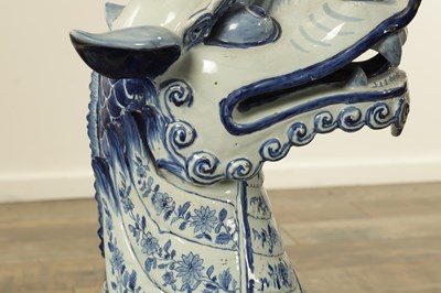 Lot 43 - A PAIR OF DELFT BLUE AND WHITE PORCELAIN MYTHICAL QILINS