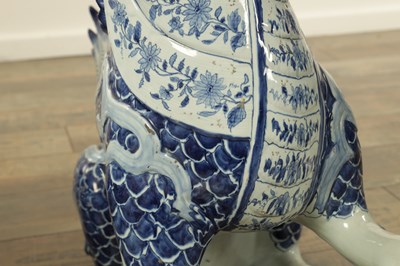 Lot 43 - A PAIR OF DELFT BLUE AND WHITE PORCELAIN MYTHICAL QILINS