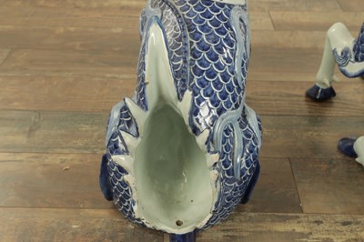 Lot 43 - A PAIR OF DELFT BLUE AND WHITE PORCELAIN MYTHICAL QILINS
