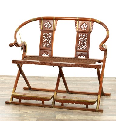 Lot 257 - A 19TH CENTURY CHINESE HARDWOOD FOLDING DOUBLE HUNTING CHAIR