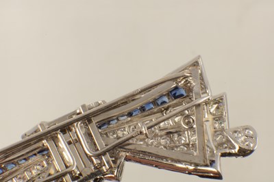 Lot 598 - AN ART DECO 18CT GOLD AND DIAMOND BOW BROOCH