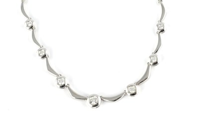 Lot 544 - A RHODIUM PLATED 18CT YELLOW GOLD DIAMOND NECKLACE