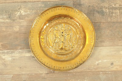 Lot 823 - A 17TH CENTURY BRASS ALMS DISH