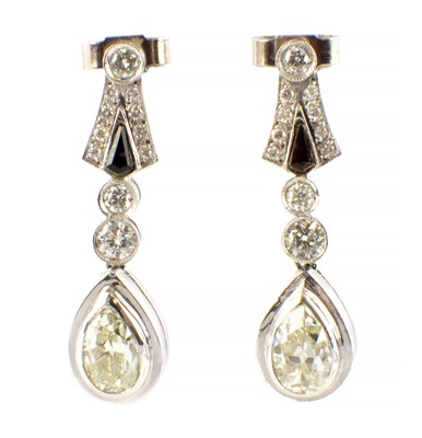 Lot 561 - A PAIR OF PLATINUM AND DIAMOND PENDANT EARRINGS