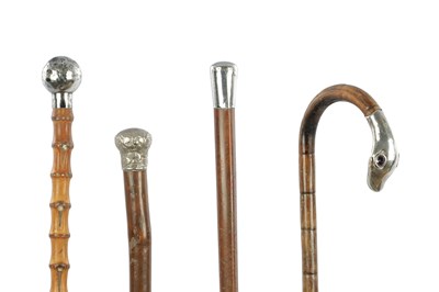 Lot 618 - A SELECTION OF FOUR SILVER TOPPED WALKING STICKS