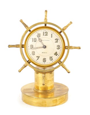 Lot 1599 - A VINTAGE GILT BRASS WALTHAM SHIPS WHEEL DESK CLOCK