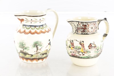 Lot 68 - TWO EARLY 19TH CENTURY LEEDS WARE SPORTING JUGS