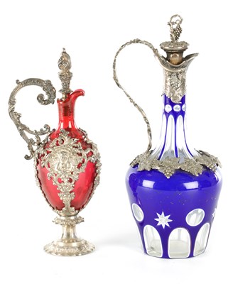 Lot 16 - TWO LATE 19TH CENTURY GLASS AND SILVER PLATED CLARET JUGS