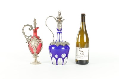 Lot 16 - TWO LATE 19TH CENTURY GLASS AND SILVER PLATED CLARET JUGS